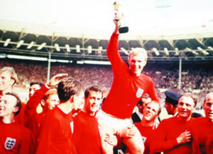 world-cup-final-1966-wembley-england-30th-july-1966-england-4-v-west-germany-2-englands-captain-bobby-moore-holds-aloft-the-jules-rimet-world-cup-trophy-as-he-sits-on-the-shoulders-of-his-teamma