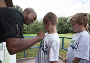 ff-ambassador-dion-dublin-signs-shirts