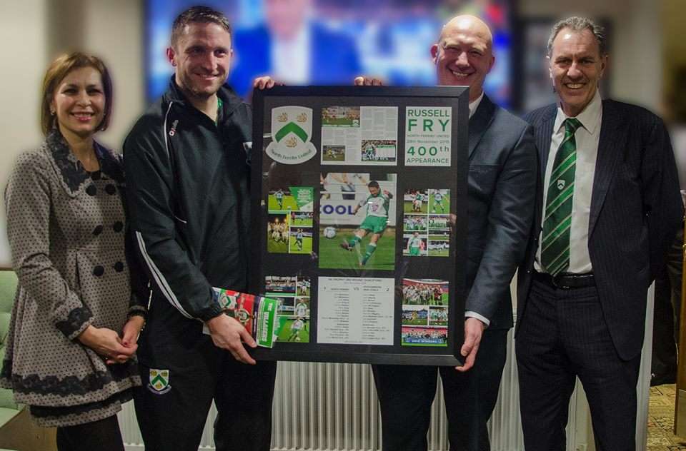 Russell Fry is presented with his memento by boss Billy Heath and Eman Forster, left, and Steve Forster, right
