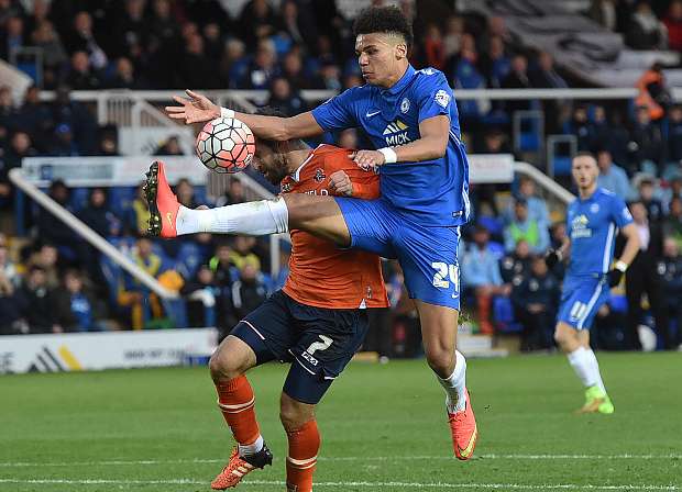 Lee Angol, right, in action for Peterborough