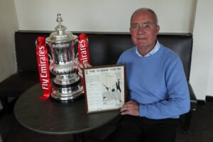 derrick-davis-with-an-original-newspaper-article-2