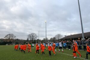 the-players-enter-the-pitch-before-the-fa-trophy-match-between-hartley-wintney-and-bromley