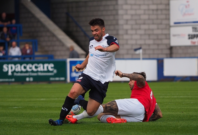 scott-burton-slides-in-to-win-the-ball-from-telfords-jack-rea