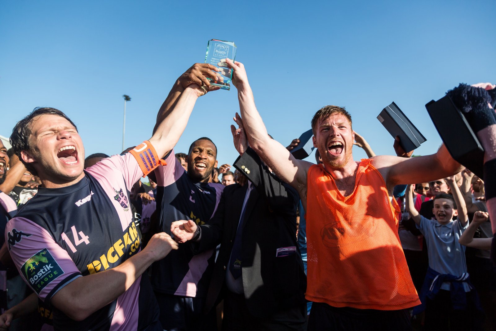 page-12-kenny-beaney-rickie-hayles-and-marc-weatherstone-lift-the-trophy