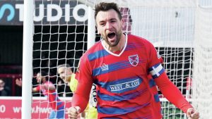 RELIEF: Josh Rees wheels away after securing a vital win for Dagenham & Redbridge PICTURE: Arfa