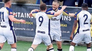 OPENER: Hawks’ Leon Maloney celebrates his goal with his team-mates PICTURE: Dave Haines