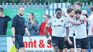 MATCHWINNER: Hooper celebrates his goal with his Hungerford team-mates PICTURE: Gary Learmouth