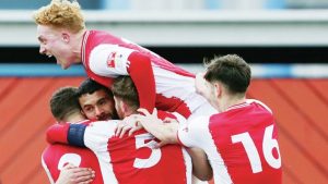 WE’RE COL AS ANYTHING: Daniel is mobbed after his winner for Ilkeston PICTURE: Gustavo Pantano