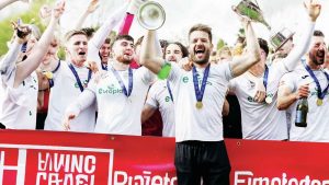 WE’RE GOING UP: Merthyr Town celebrate winning promotion to Step 2 on Easter Monday PICTURE: John Smith