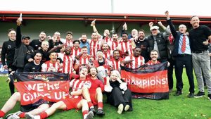 GROUP EFFORT: Brackley Town players and staff celebrate winning the National League North title PICTURE: Pete Keen