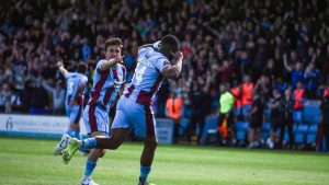 Carlton Ubaezuonu scores for Scunthorpe against Chorley in the semi-finals to set up the tie against Chester PICTURE: Alamy