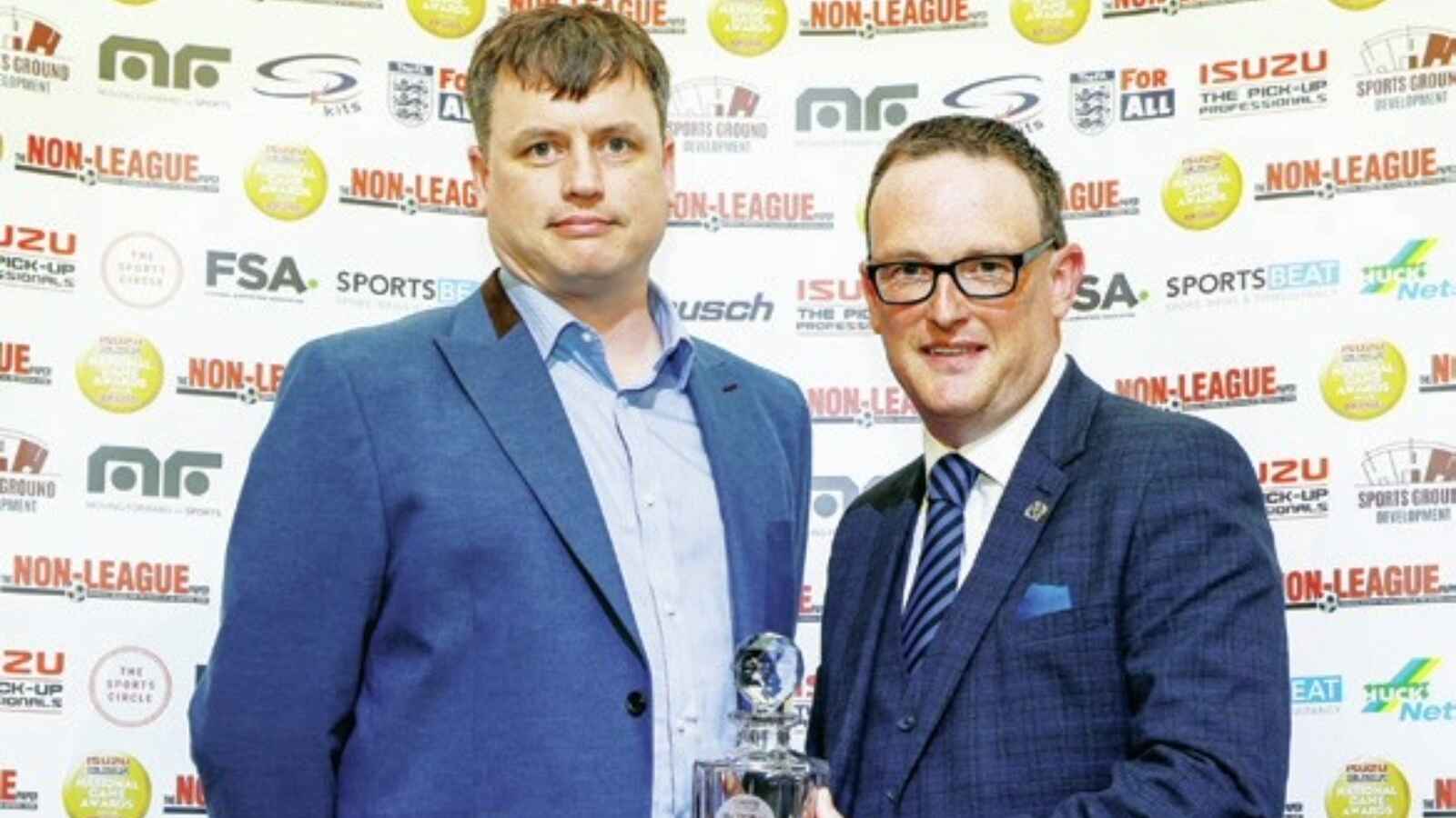 CHAMPION: Jamie Marler, left, from Moving Forward Sports, presents the award to Chorley’s Alistair Leggat