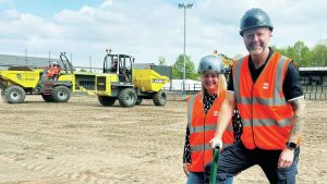 BUILDING A FUTURE: Hednesford Town owners Amanda and Craig Gwilt get their hands dirty