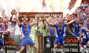 Oldham Athletic players celebrate with the trophy PICTURE: Alamy