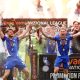 Oldham Athletic players celebrate with the trophy PICTURE: Alamy