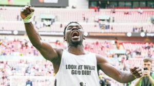 Mike Fondop celebrates Oldham Athletic's National League final play-off victory over Southend United at Wembley