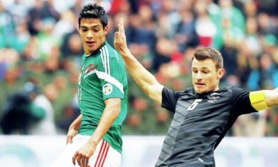BIG COMPANY: Tommy Smith, of New Zealand, lunges to thwart Mexico’s Raul Jimenez during a 2014 World Cup play-off game