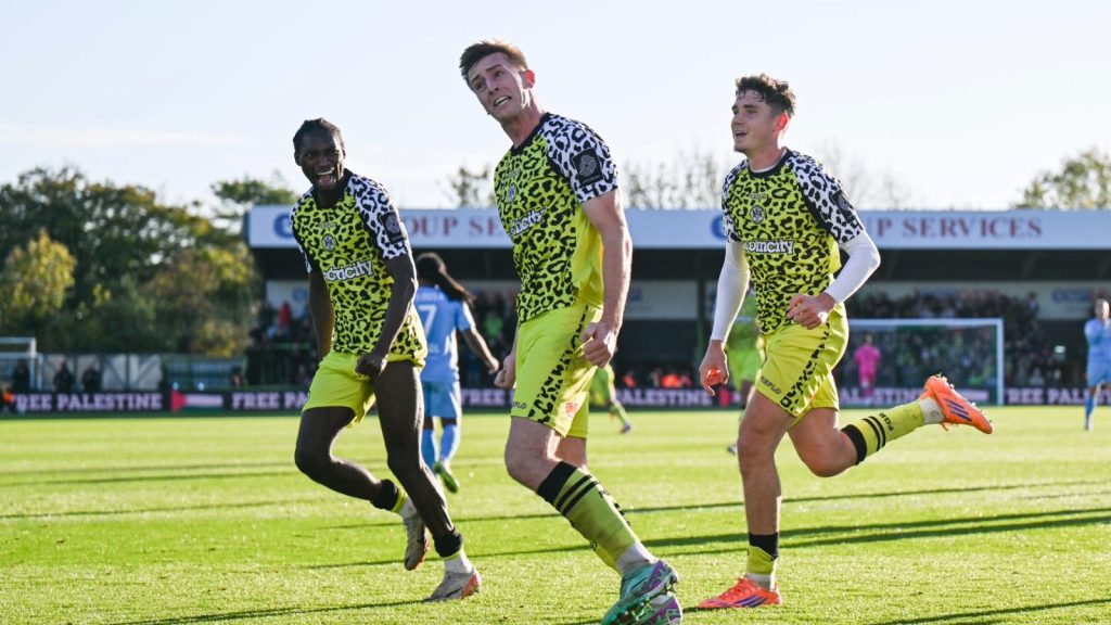 Harvey Bunker wheels away in celebration after converting the decisive penalty to give Robbie Savage’s Forest Green Rovers all three points