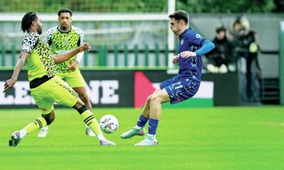 Forest Green’s James Balagizi, left, gets to the ball before Rochdale’s Connor McBride