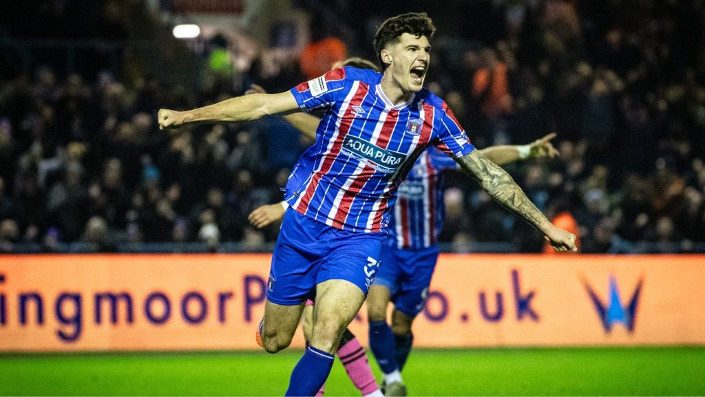 Harvey Macadam wheels away after scoring Carlisle United’s third goal against Forest Green Rovers