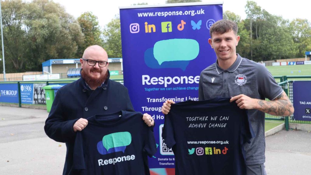 Martin Spackman, MD of TotalQ, with Hoops defender Charlie Wiggett.
