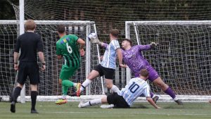 Michael Hopkins scores the second goal against Chelmsley Town as Kidlington advance to the next round