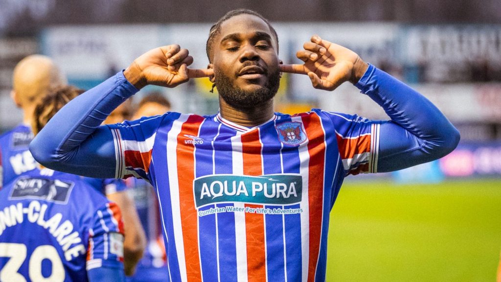Junior Luamba celebrates for Carlisle United