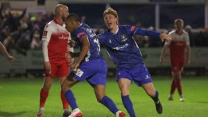Sisa Tuntulwana wheels away after heading Gainsborough Trinity level against Accrington Stanley