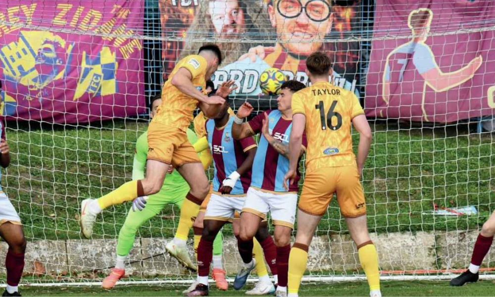 Sutton United’s Harry Phipps scores against Farnham Town