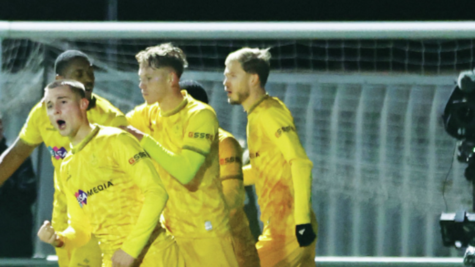 :Kai Jennings celebrates his goal for Sutton United