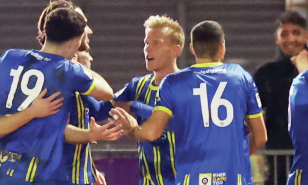 Louis Britton is mobbed after scoring Weston-super-Mare’s first goal