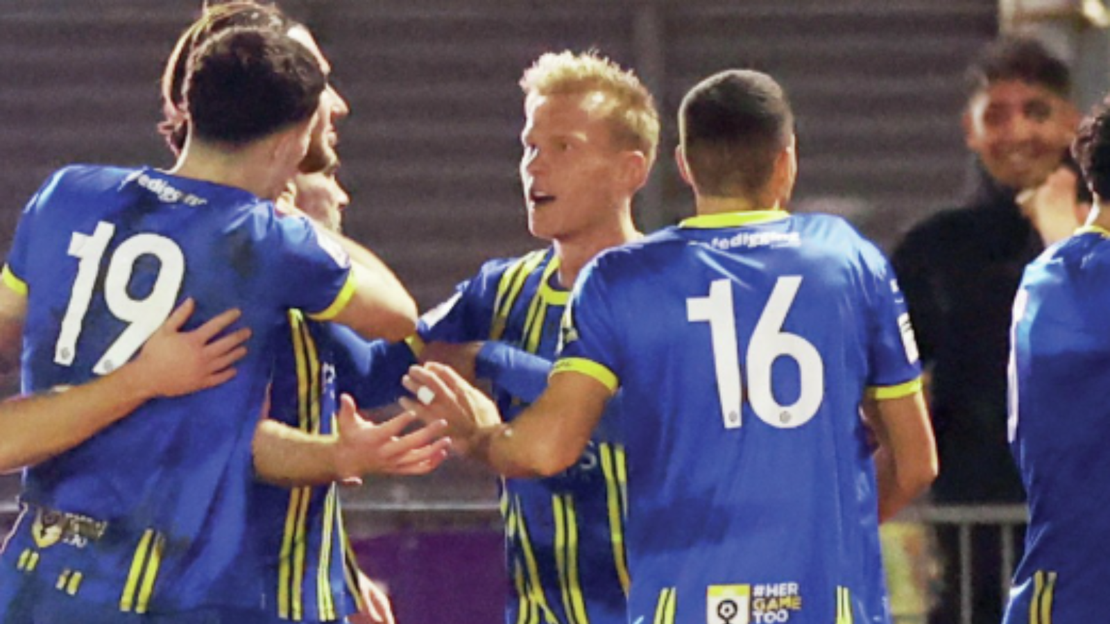 Louis Britton is mobbed after scoring Weston-super-Mare’s first goal