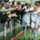 Macclesfield players celebrate James Edmondson’s fine second goal against Slough Town with fans. 