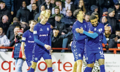 Rochdale’s Tyler Smith is mobbed after grabbing their third goal.