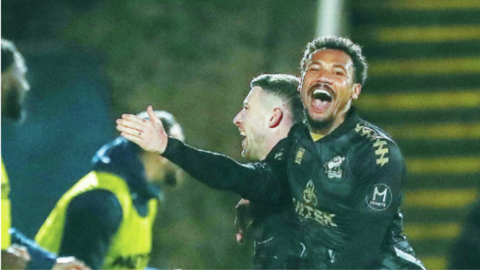 Cal Roberts is congratulated by Scunthorpe teammate Tyler Denton after scoring his and his side’s second goal