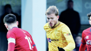 Lewis Simper runs at the Aldershot defence