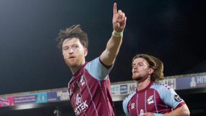 Danny Whitehall celebrates his goal from the spot for Scunthorpe United