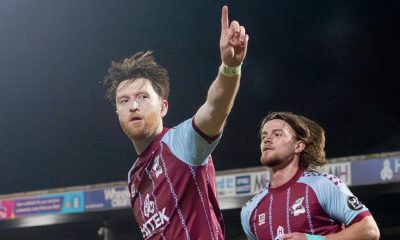 Danny Whitehall celebrates his goal from the spot for Scunthorpe United