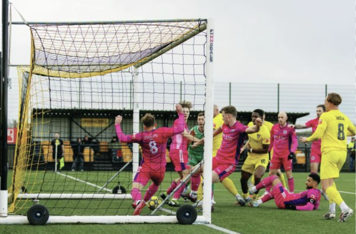 Harborough try to scramble the ball over the line