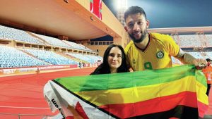 Macauley Bonne and his wife Chloe at AFCON with Zimbabwe