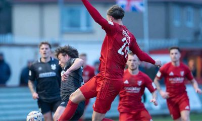 Scarborough Athletic’s Richie Bennett fights for possession