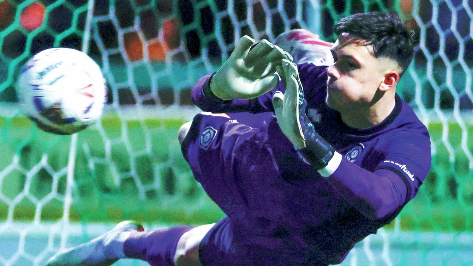 Yeovil keeper Jed Ward flies through the air to save in the shoot-out