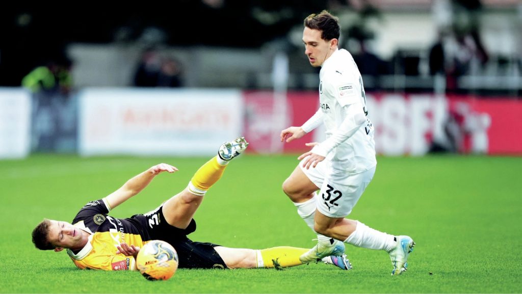 Boreham Wood&rsquo;s Matt Rush, right, takes on Burton Albion&rsquo;s Jack Armer