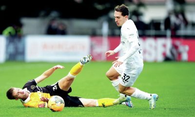 Boreham Wood’s Matt Rush, right, takes on Burton Albion’s Jack Armer