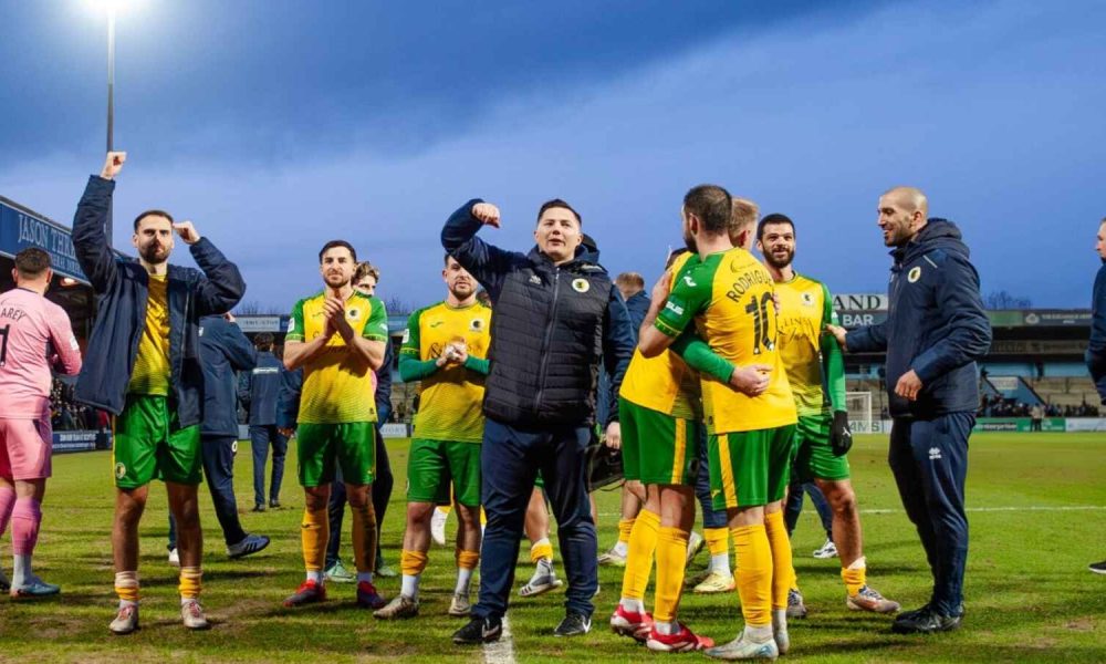 Horsham players and staff celebrate their victory over Scunthorpe United in the Isuzu FA Trophy