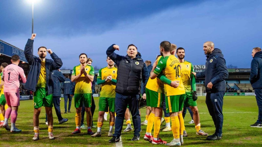 Horsham players and staff celebrate their victory over Scunthorpe United in the Isuzu FA Trophy