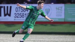 Sixteen-year-old James Potter celebrates scoring the decisive penalty for Marine