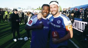 Macclesfield FC goalscorers Isaac Buckley-Ricketts, left, and Paul Dawson, right, celebrate Macclesfield’s historic victory over Crystal Palace