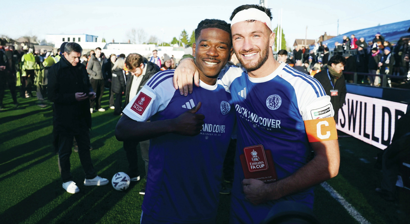 Macclesfield FC goalscorers Isaac Buckley-Ricketts, left, and Paul Dawson, right, celebrate Macclesfield’s historic victory over Crystal Palace