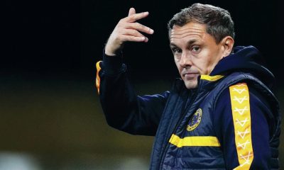 Paul Hurst on the touchline at Shrewsbury Town in 2024, and inset below, lifting the National League play-off final trophy with Grimsby Town